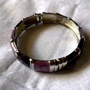 Like new clamp bracelet. Light medium and dark purple Super shiny silvertone